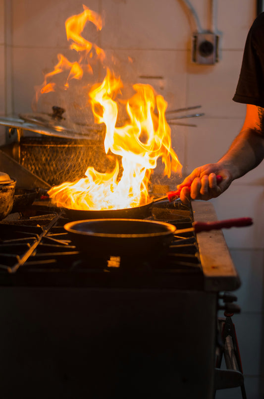sizzling pan on fire